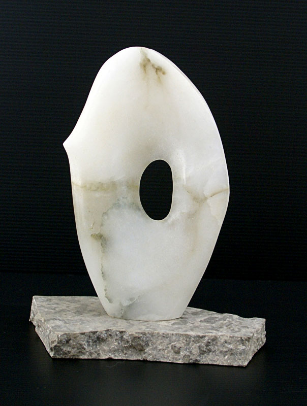 White alabaster standing form with hollowed out ring