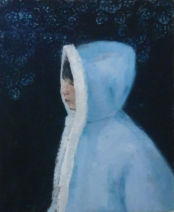 Young girl wearing blue winter parka with white faux fur trim